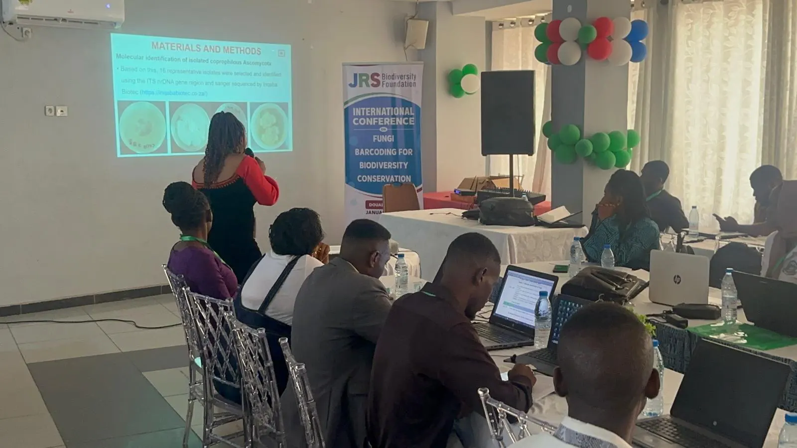 A PhD student presenting her research findings